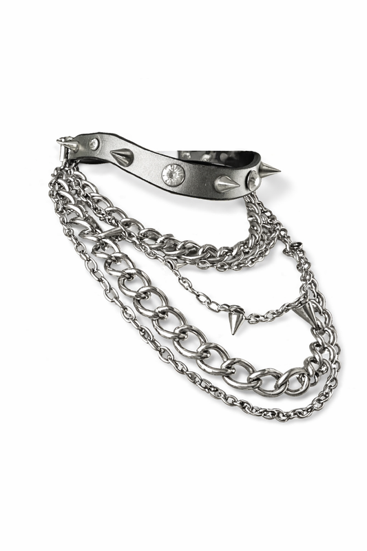 Metallic chain accessory with spikes on a white background
