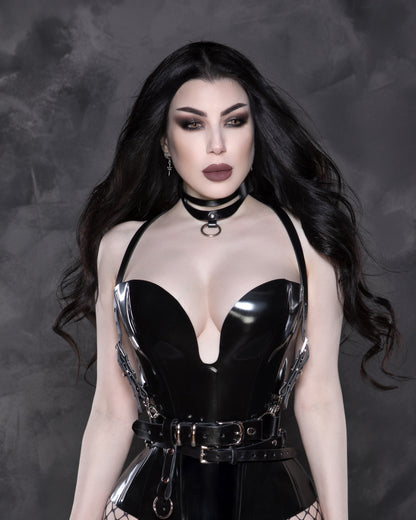 Girl wearing leather choker and harness