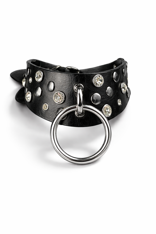 Black leather choker with studs and a silver ring on a white background