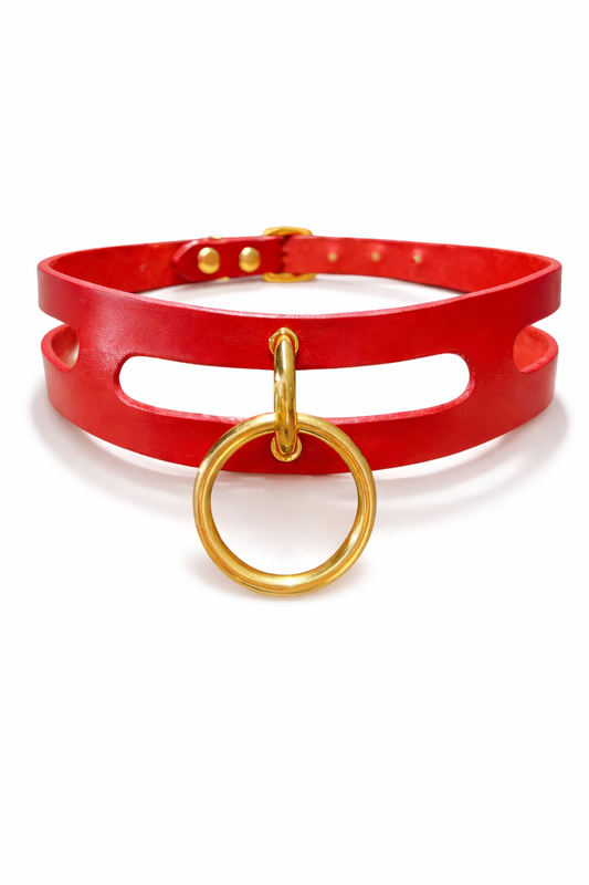 Red leather choker with gold hardware on a white background